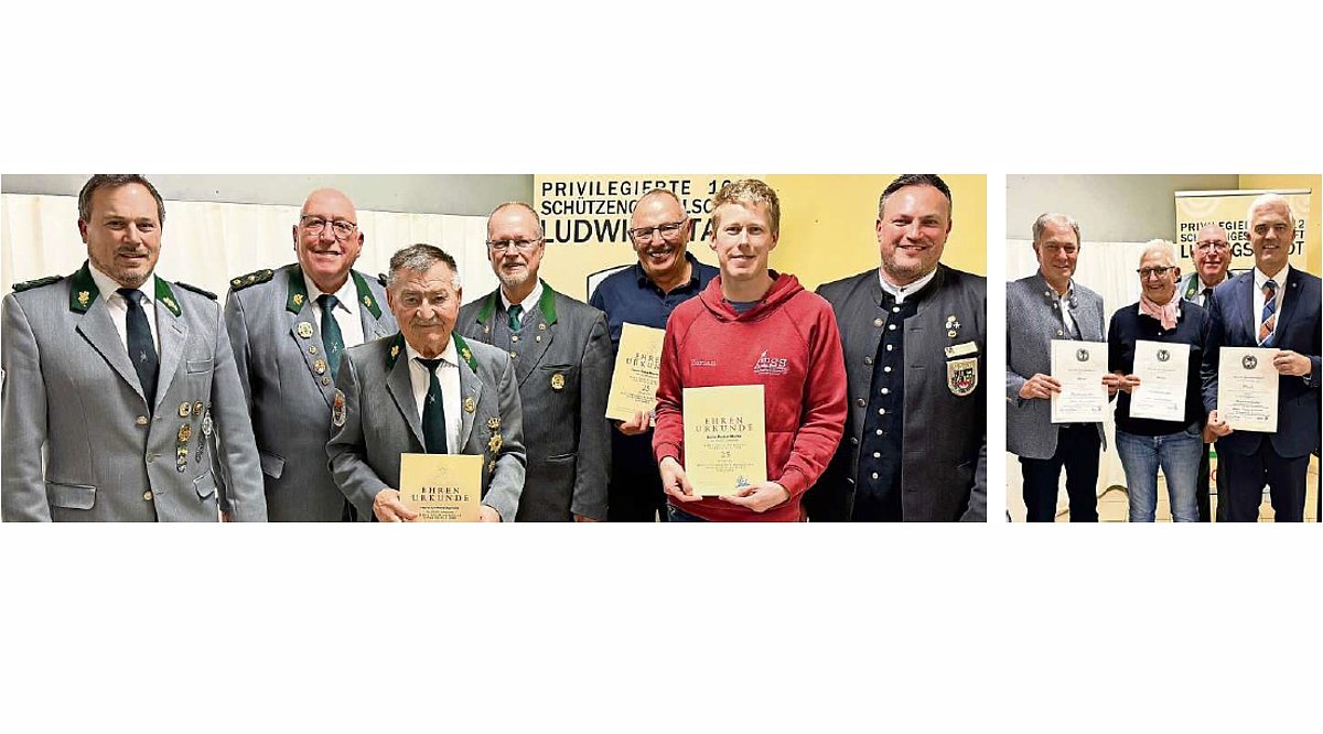 Eine Gruppe von Menschen stehen zusammen und lächeln in die Kamera. Sie tragen dunkelgraue Schützenuniformen und schwarze Anzüge. Sechs von ihnen halten je eine Urkunde in ihren Händen.